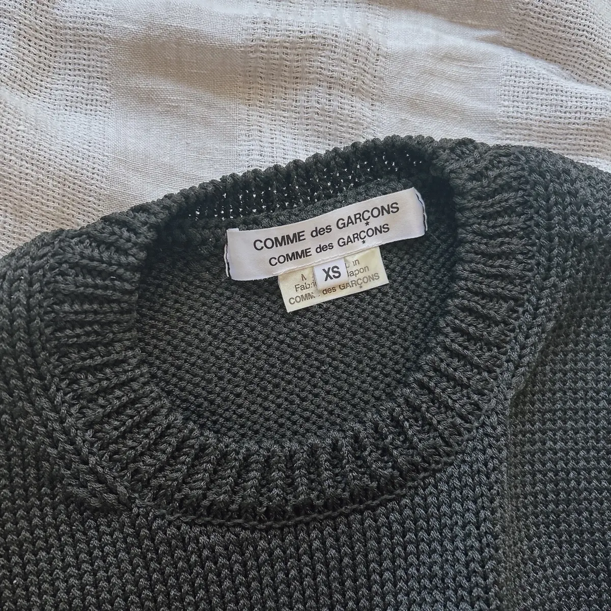 コムデギャルソンコムデギャルソンの黒ニット タグ