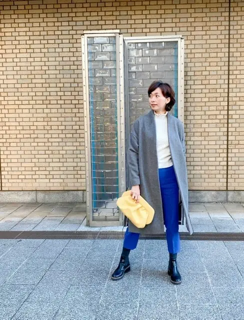 イエローのクラッチbagをアクセントにの画像_1