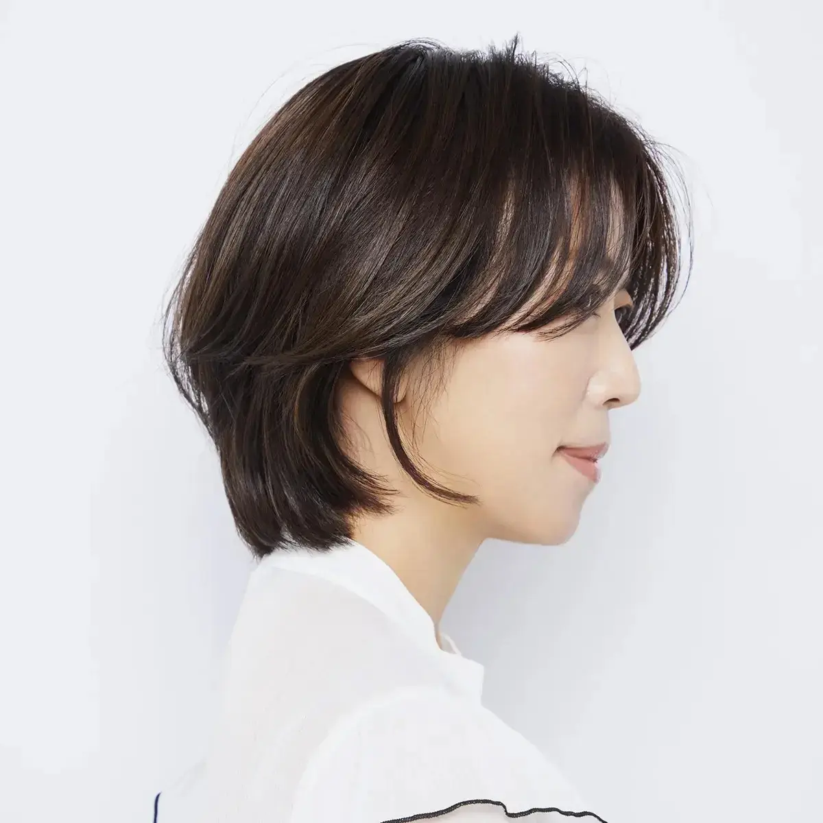 ひし形フォルムと、パーマを必要な部分にポイントで。複合的なお悩みを一気に解消