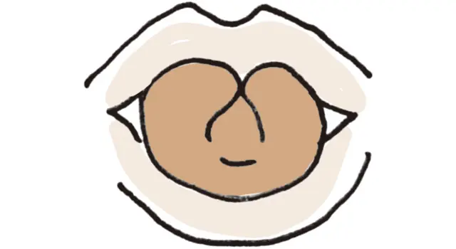 舌を縦に丸め、両端をくっつける
