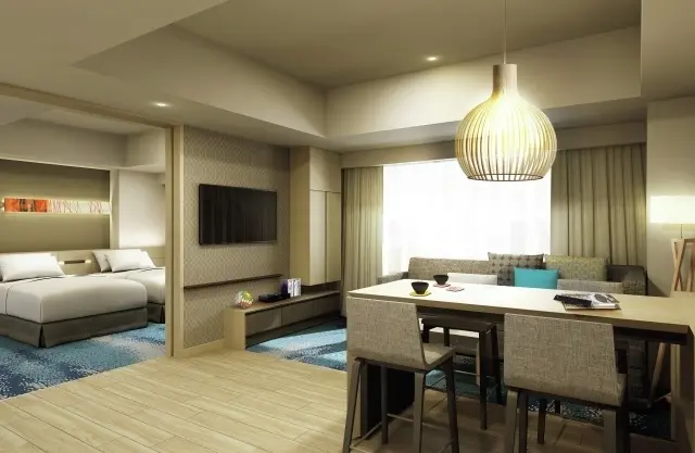 「キッチン スイート ツイン」は、キッチン、リビングとワークエリアつきダイニングがある約54㎡の客室