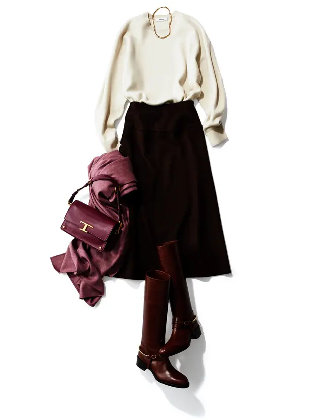 スカートとロングブーツの色をそろえて下半身をすっきりスマートに