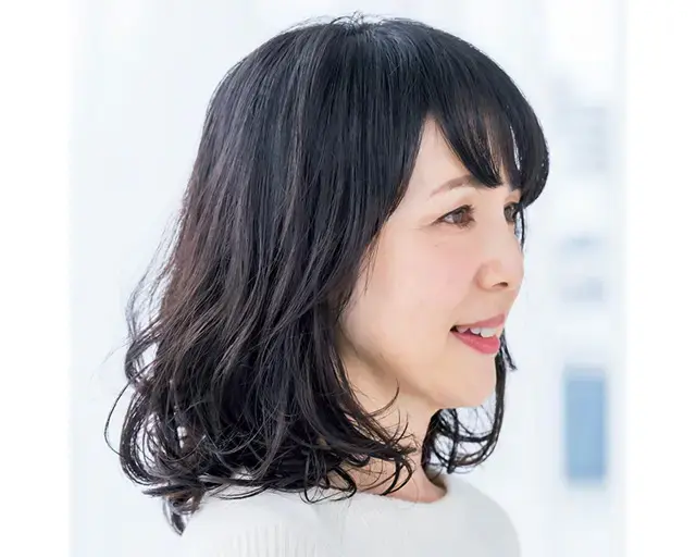 大胆なSカールのパーマで全体をボリュームアップ