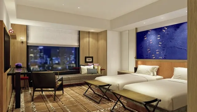 38㎡あるデラックスツインの客室。ソファベッドを備え、大人3名まで滞在できる