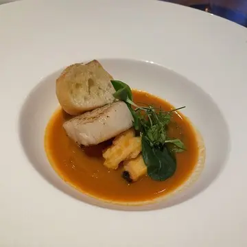 ダイニングルーム・ウェスタンキュイジーヌの料理 ホタテ貝のポワレ